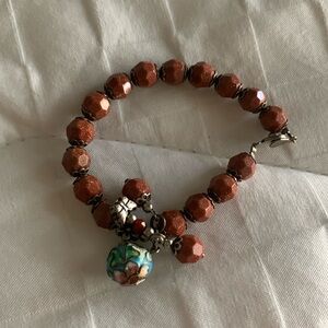 Sand stone bracelet with a little cool charms